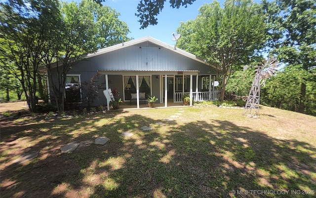 5328 Monroe Rd, Kingston, OK 73439 - rear view of house with a sunroom