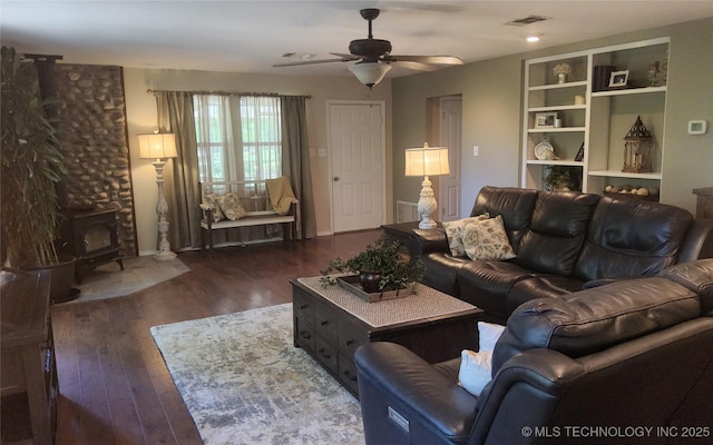 5328 Monroe Rd, Kingston, OK 73439 - living room with a wood stove, a ceiling fan, and wood finished floors