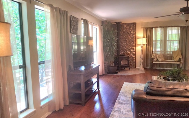 5328 Monroe Rd, Kingston, OK 73439 - living area featuring plenty of natural light, wood finished floors, and a ceiling fan