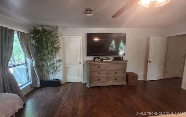 5328 Monroe Rd, Kingston, OK 73439 - bedroom featuring dark wood-style floors, multiple windows, and a ceiling fan