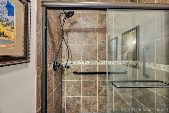 bathroom with a shower stall