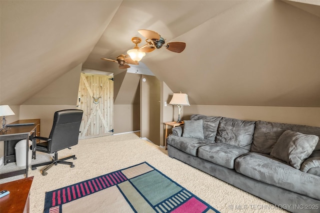 home office with carpet flooring, a ceiling fan, and vaulted ceiling