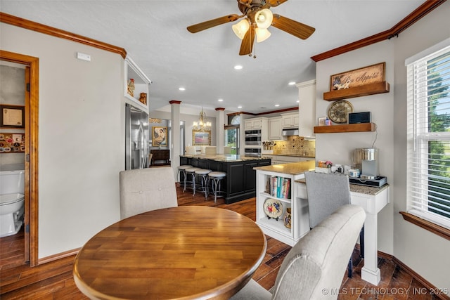 dining space with crown molding, baseboards, a ceiling fan, dark wood finished floors, and recessed lighting
