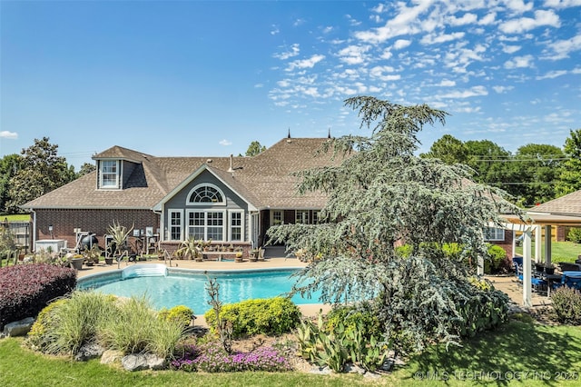 outdoor pool featuring a patio area