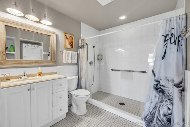 bathroom featuring tiled shower, toilet, tile patterned floors, vanity, and recessed lighting