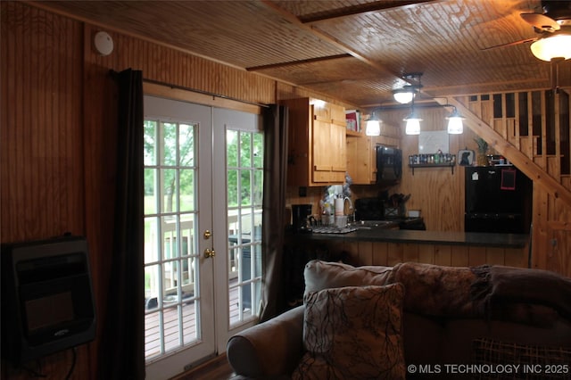 6363 S Brewer Rd, Kiowa, OK 74553 - living room featuring ceiling fan, wood ceiling, wooden walls, and french doors