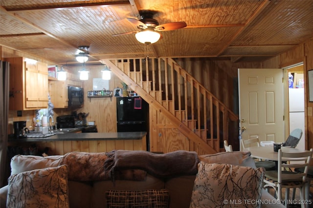 6363 S Brewer Rd, Kiowa, OK 74553 - living room with wooden walls, stairs, wooden ceiling, and a ceiling fan
