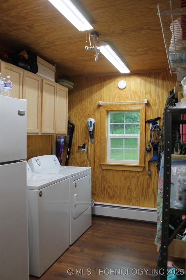 6363 S Brewer Rd, Kiowa, OK 74553 - laundry area with cabinet space, separate washer and dryer, a baseboard radiator, wooden ceiling, and wooden walls