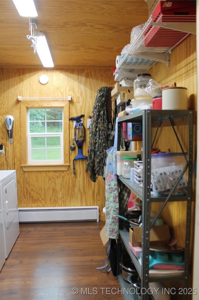 6363 S Brewer Rd, Kiowa, OK 74553 - storage area featuring a baseboard heating unit and washer and clothes dryer