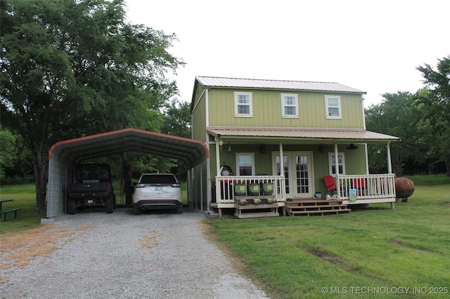 6363 S Brewer Rd, Kiowa, OK 74553 - country-style home with gravel driveway, a front lawn, a detached carport, a porch, and heating fuel