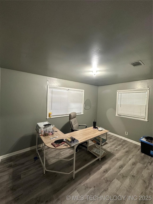office space featuring wood finished floors and baseboards