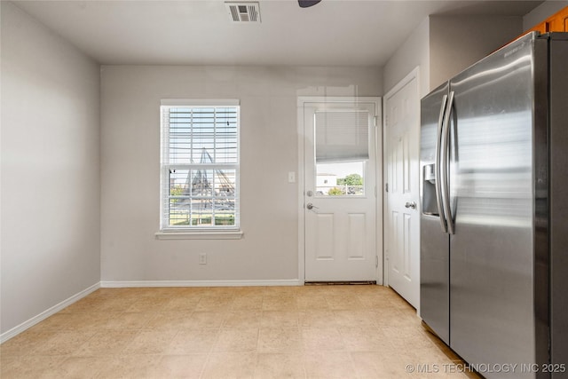 14768 S Fern Pl E, Glenpool, OK 74033 - kitchen with stainless steel fridge with ice dispenser and baseboards