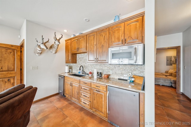 441 Ramey St, Eucha, OK 74342 - kitchen with appliances with stainless steel finishes, a sink, tasteful backsplash, and dark tile patterned flooring
