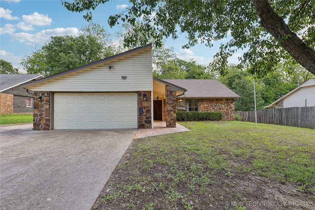 mid-century inspired home with stone siding, concrete driveway, and an attached garage