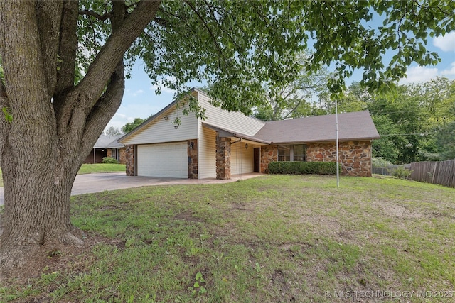 mid-century inspired home with stone siding, concrete driveway, and an attached garage
