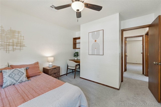 carpeted bedroom featuring baseboards and a ceiling fan