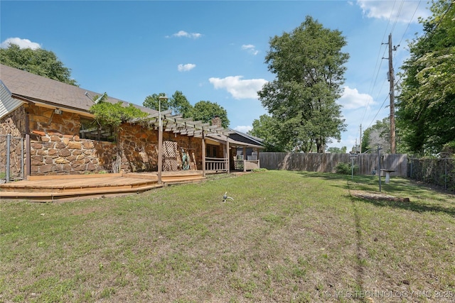 view of yard with a wooden deck