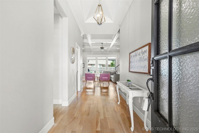 12113 S Fulton Ave E, Bixby, OK 74008 - hallway featuring coffered ceiling, baseboards, light wood-style floors, and beam ceiling