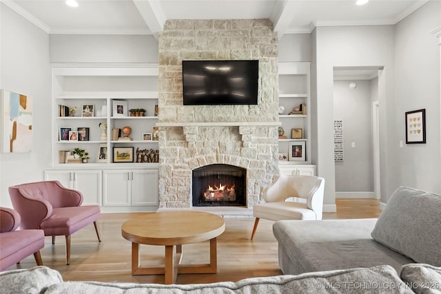 12113 S Fulton Ave E, Bixby, OK 74008 - living area featuring light wood-style floors, built in shelves, a fireplace, crown molding, and baseboards
