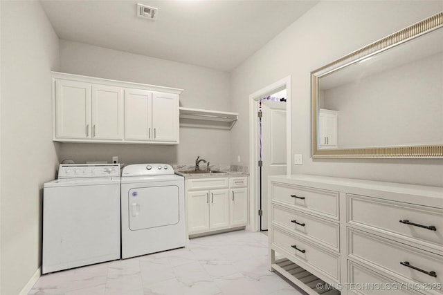 12113 S Fulton Ave E, Bixby, OK 74008 - washroom featuring cabinet space, light marble finish flooring, separate washer and dryer, and baseboards