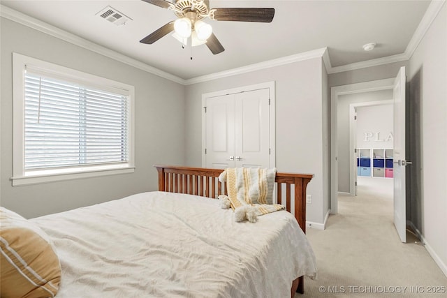 12113 S Fulton Ave E, Bixby, OK 74008 - bedroom featuring light colored carpet, a closet, ornamental molding, a ceiling fan, and baseboards