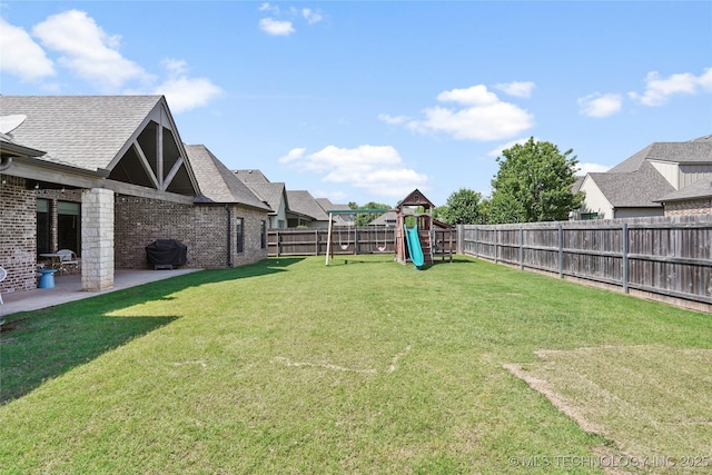 12113 S Fulton Ave E, Bixby, OK 74008 - view of yard featuring a playground and a patio area