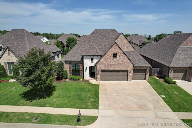 12113 S Fulton Ave E, Bixby, OK 74008 - french country home with a front lawn, concrete driveway, a garage, and roof with shingles