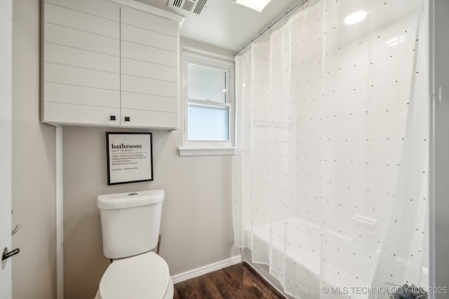 6505 E 47th St, Tulsa, OK 74145 - full bathroom with baseboards, toilet, wood finished floors, and shower / bath combination with curtain