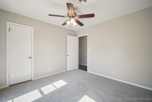 6505 E 47th St, Tulsa, OK 74145 - unfurnished bedroom featuring carpet flooring, baseboards, and a ceiling fan