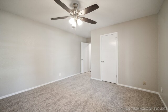 6505 E 47th St, Tulsa, OK 74145 - unfurnished bedroom with carpet, baseboards, and a ceiling fan