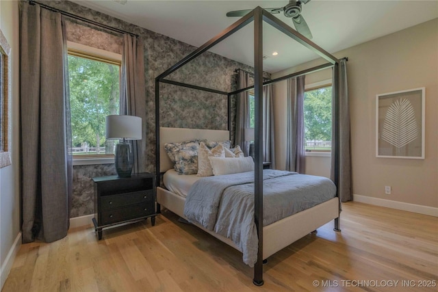6407 N Blue Sage Dr, Owasso, OK 74055 - bedroom featuring baseboards, wood finished floors, and wallpapered walls