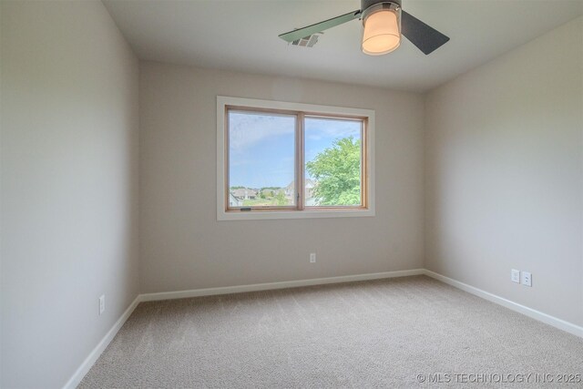 6407 N Blue Sage Dr, Owasso, OK 74055 - spare room with carpet, baseboards, and ceiling fan