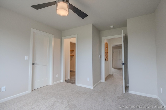 6407 N Blue Sage Dr, Owasso, OK 74055 - unfurnished bedroom featuring carpet, baseboards, and a ceiling fan