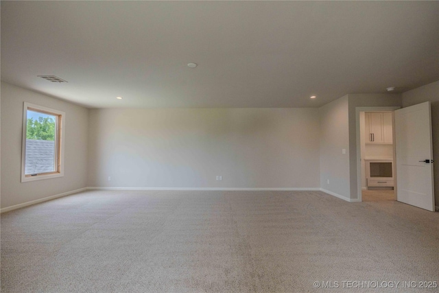 6407 N Blue Sage Dr, Owasso, OK 74055 - unfurnished room featuring light colored carpet, recessed lighting, and baseboards