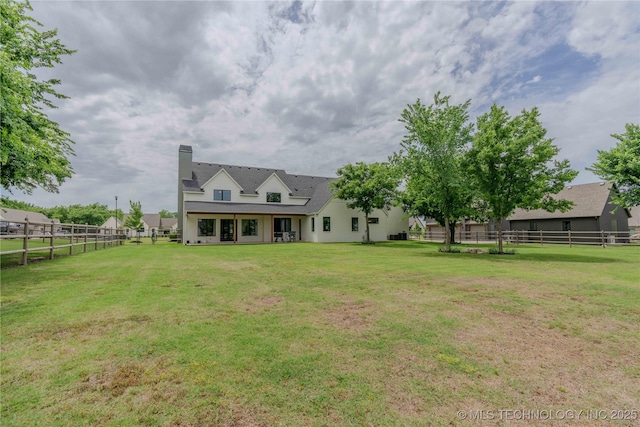 6407 N Blue Sage Dr, Owasso, OK 74055 - back of property with a chimney