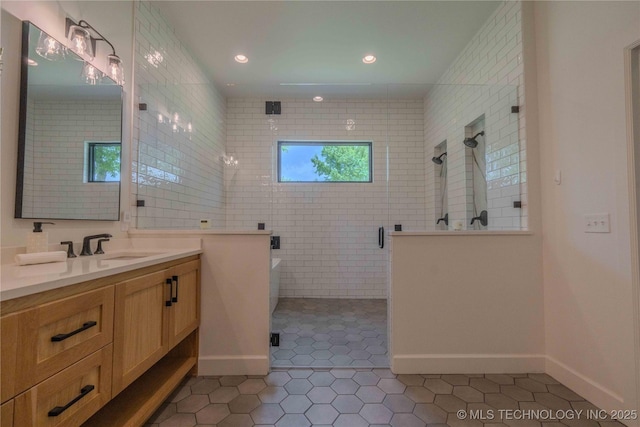 6407 N Blue Sage Dr, Owasso, OK 74055 - full bath with tile patterned floors, a stall shower, vanity, baseboards, and recessed lighting