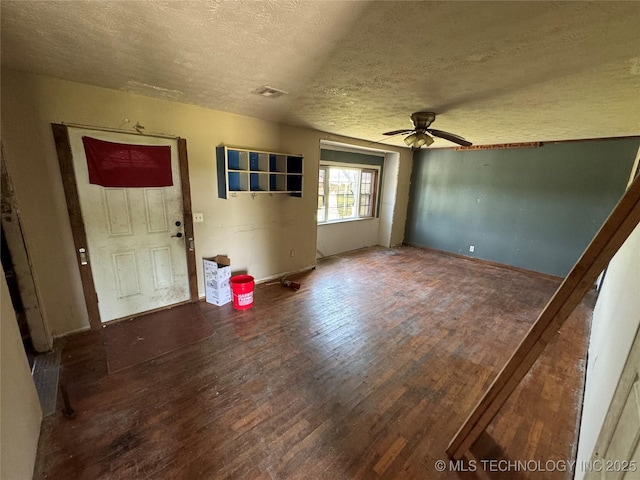 18700 E 600th Rd, Inola, OK 74036 - entrance foyer featuring a textured ceiling, wood finished floors, ceiling fan, and baseboards
