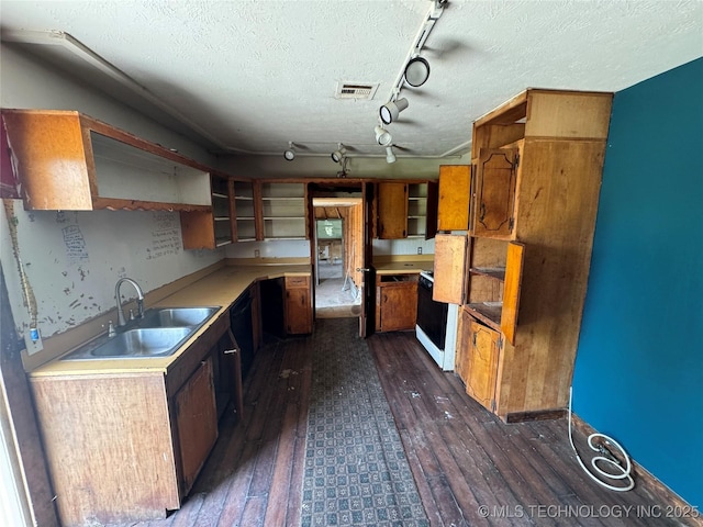 18700 E 600th Rd, Inola, OK 74036 - kitchen featuring open shelves, a sink, dark wood-style floors, rail lighting, and a textured ceiling