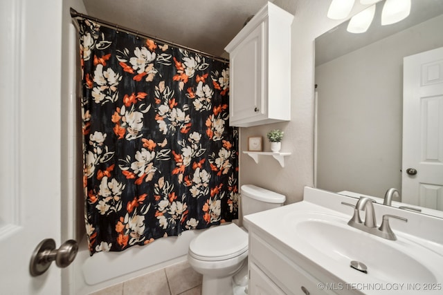 full bathroom featuring toilet, tile patterned flooring, vanity, and shower / bathtub combination with curtain