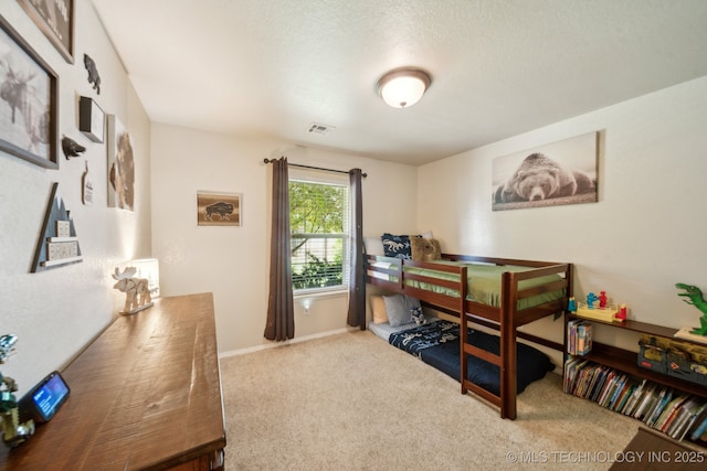 carpeted bedroom with baseboards
