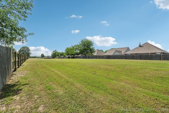 view of yard with fence