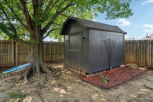 view of shed with a fenced backyard