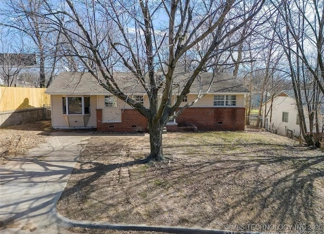 233 N 44th W Ave, Tulsa, OK 74127 - view of front of home featuring crawl space, driveway, fence, and brick siding