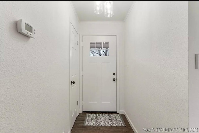 233 N 44th W Ave, Tulsa, OK 74127 - doorway featuring dark wood-type flooring, a textured wall, ornamental molding, a chandelier, and baseboards