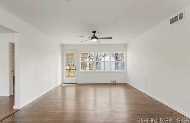 233 N 44th W Ave, Tulsa, OK 74127 - spare room with a ceiling fan, wood finished floors, and baseboards