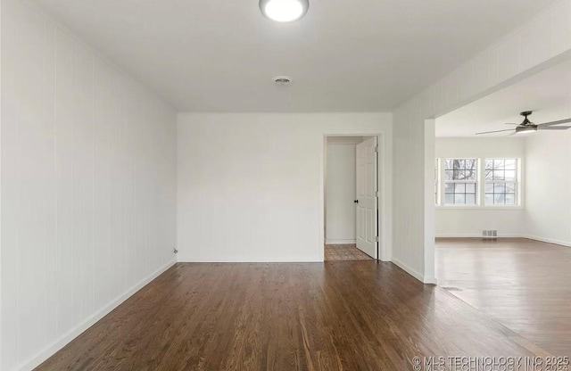 233 N 44th W Ave, Tulsa, OK 74127 - empty room featuring wood finished floors, baseboards, ceiling fan, and a smoke detector