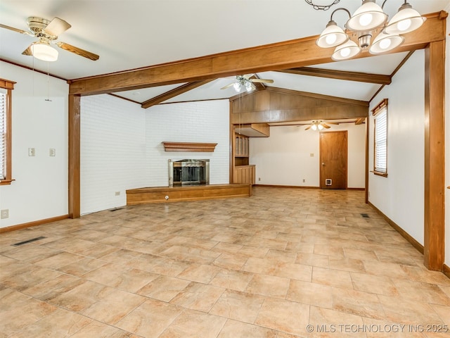 7446 E 20th St, Tulsa, OK 74112 - unfurnished living room featuring a ceiling fan, a brick fireplace, a chandelier, and light stone finish floors