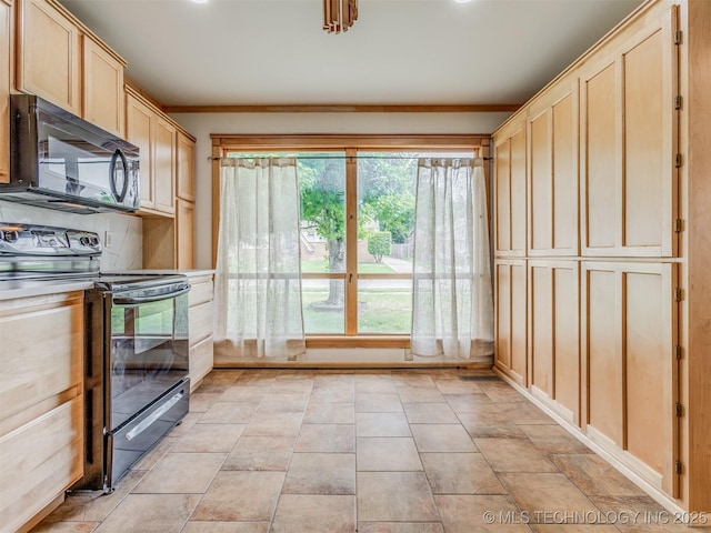 7446 E 20th St, Tulsa, OK 74112 - kitchen with black appliances and light brown cabinets
