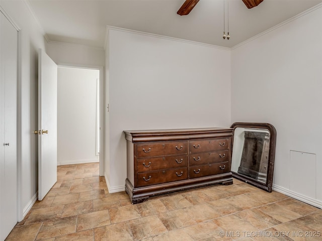 7446 E 20th St, Tulsa, OK 74112 - unfurnished bedroom featuring stone finish floors, baseboards, crown molding, and a ceiling fan