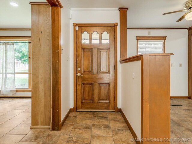 7446 E 20th St, Tulsa, OK 74112 - entrance foyer featuring ornamental molding, ceiling fan, and healthy amount of natural light